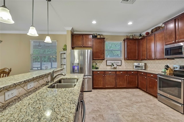 kitchen with a sink, decorative backsplash, ornamental molding, and stainless steel appliances