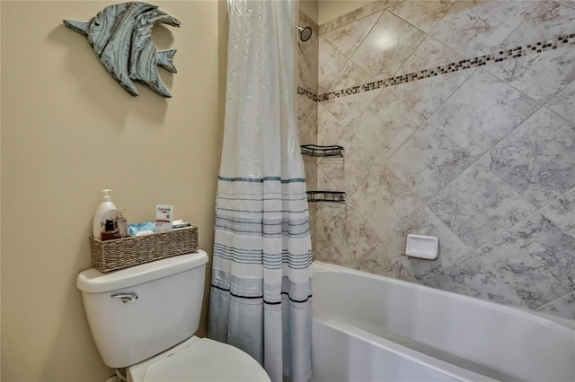 bathroom with shower / bath combo with shower curtain and toilet