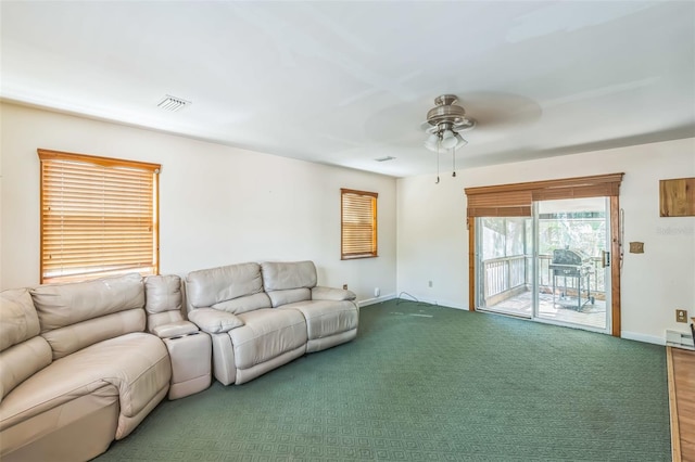 526 Kings Creek Cir, Steinhatchee, FL 32359 - carpeted living room featuring baseboard heating, ceiling fan, visible vents, and baseboards