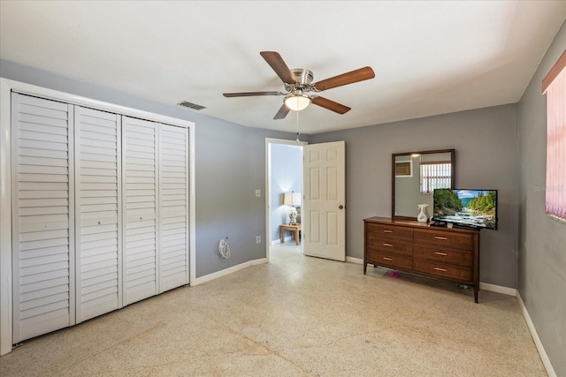 bedroom with visible vents, a ceiling fan, baseboards, and a closet