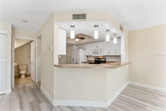 14506 Alejo Ct, Seminole, FL 33776 - kitchen with white appliances, light wood-style flooring, a ceiling fan, white cabinetry, and baseboards