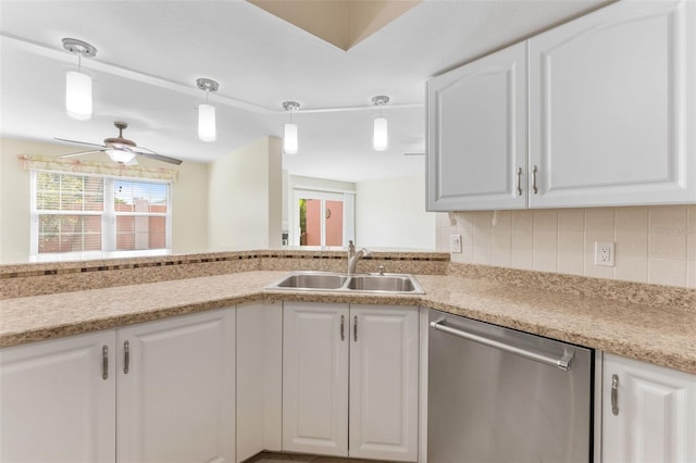 14506 Alejo Ct, Seminole, FL 33776 - kitchen featuring dishwasher, a sink, healthy amount of natural light, and white cabinetry