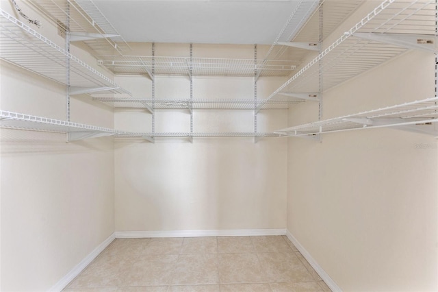 14506 Alejo Ct, Seminole, FL 33776 - walk in closet featuring tile patterned flooring