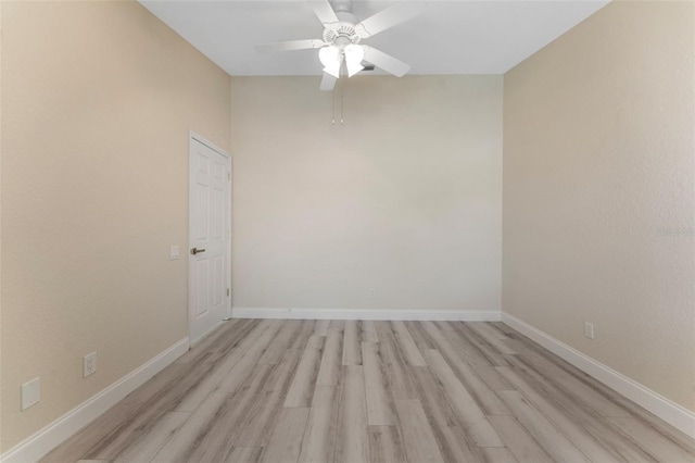 14506 Alejo Ct, Seminole, FL 33776 - empty room with light wood finished floors, ceiling fan, and baseboards