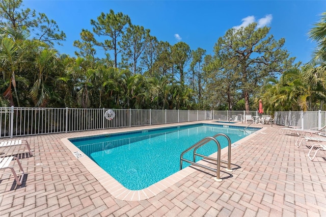 14506 Alejo Ct, Seminole, FL 33776 - community pool with a patio area and view of wooded area