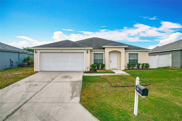 1639 Saddlehorn Dr, Lakeland, FL 33810 - single story home with a garage, stucco siding, driveway, and a front lawn