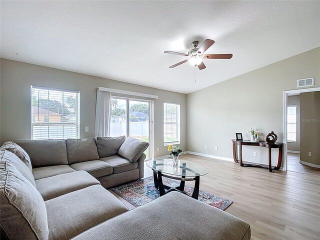 1639 Saddlehorn Dr, Lakeland, FL 33810 - living room with ceiling fan, visible vents, baseboards, and light wood finished floors