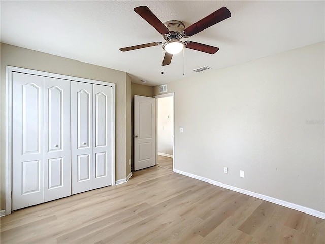 1639 Saddlehorn Dr, Lakeland, FL 33810 - unfurnished bedroom featuring baseboards, a closet, light wood-style flooring, and visible vents