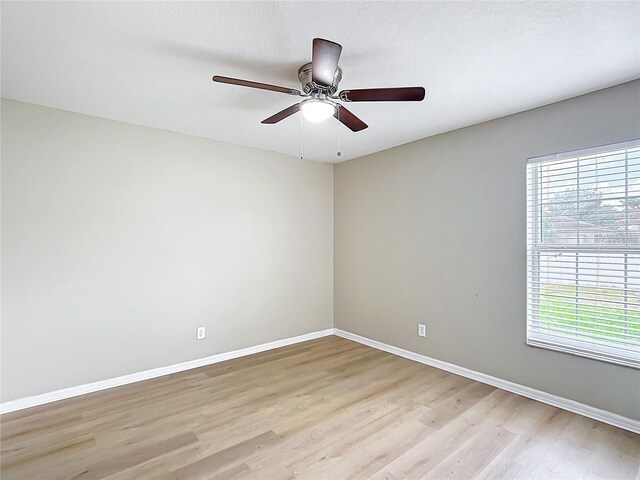 1639 Saddlehorn Dr, Lakeland, FL 33810 - spare room featuring baseboards, a ceiling fan, and light wood-style flooring
