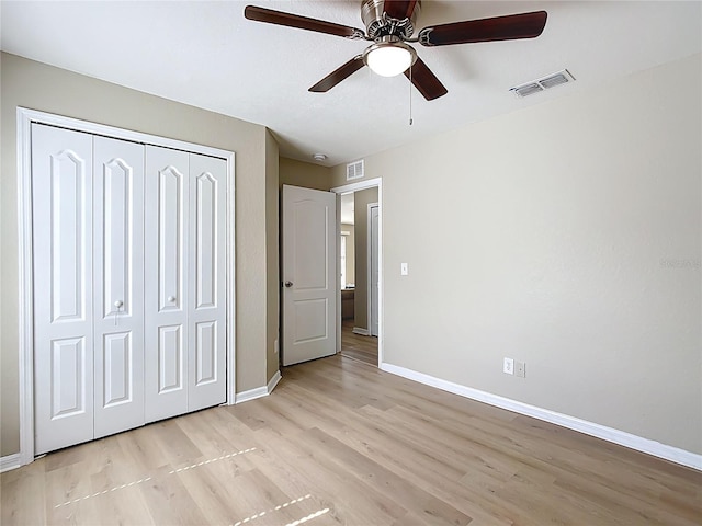 1639 Saddlehorn Dr, Lakeland, FL 33810 - unfurnished bedroom with light wood-style floors, baseboards, a closet, and visible vents