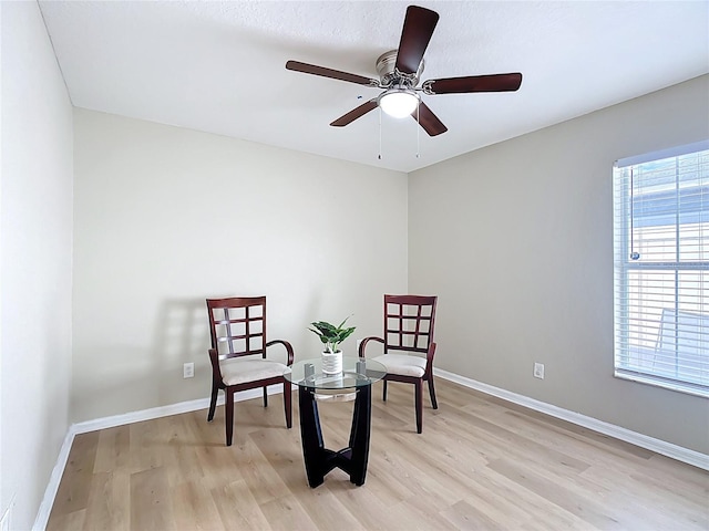 1639 Saddlehorn Dr, Lakeland, FL 33810 - sitting room featuring baseboards, a ceiling fan, and light wood finished floors