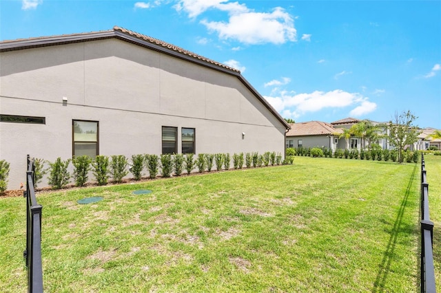 17804 Brewster Grn, Lutz, FL 33559 - view of side of property featuring a lawn and stucco siding