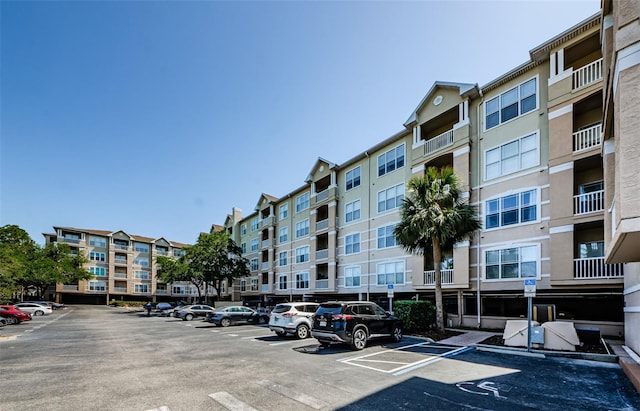 view of property featuring uncovered parking