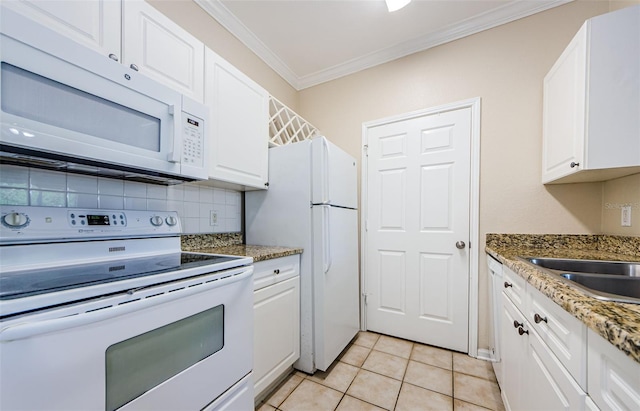 kitchen with crown molding, decorative backsplash, white appliances, and white cabinetry