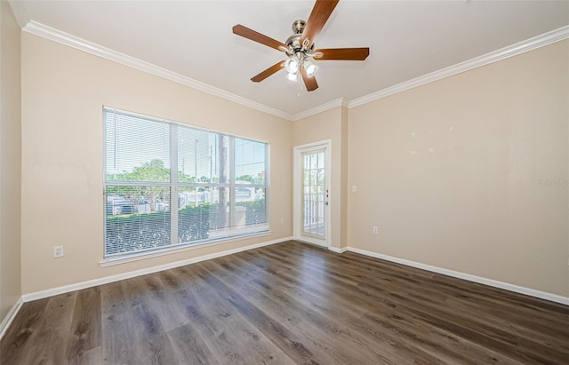 empty room with crown molding, baseboards, and dark wood-style flooring
