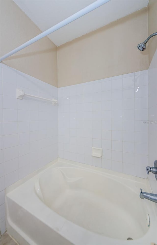 bathroom with shower / washtub combination