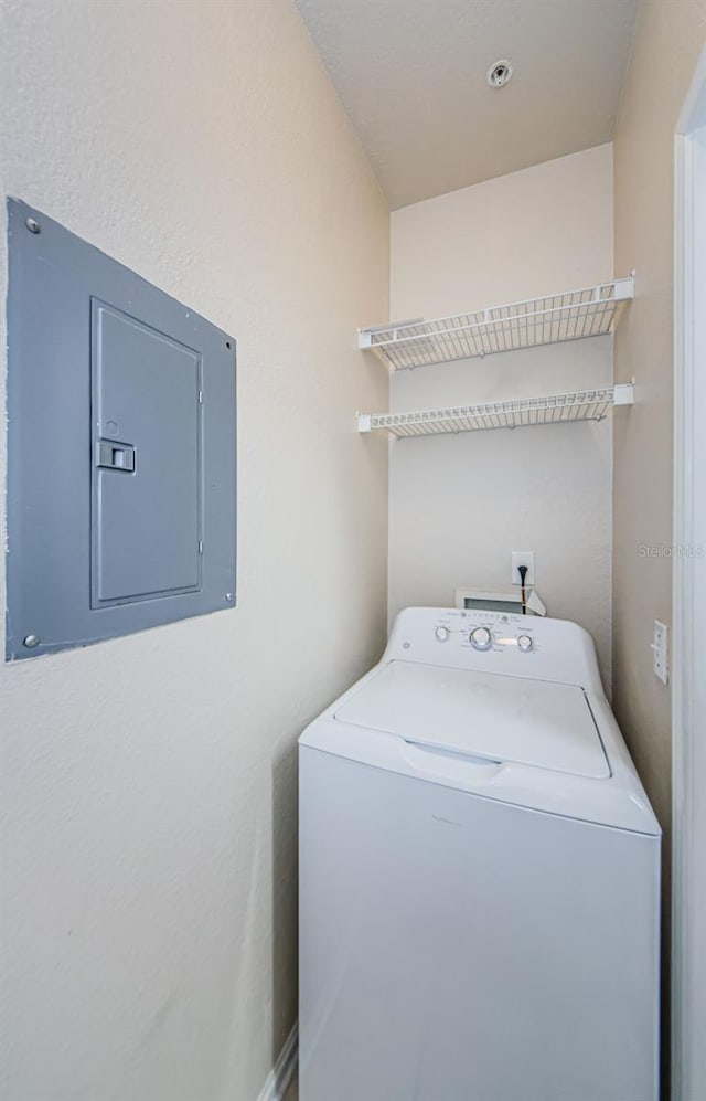 washroom with washer / clothes dryer, laundry area, and electric panel