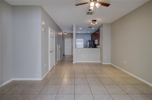 unfurnished living room featuring ceiling fan, visible vents, light tile patterned floors, baseboards, and recessed lighting