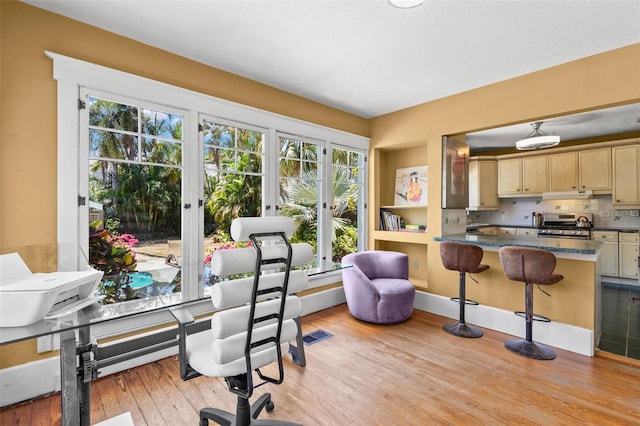interior space with light wood-style floors and visible vents