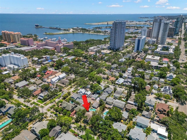 birds eye view of property with a city view and a water view