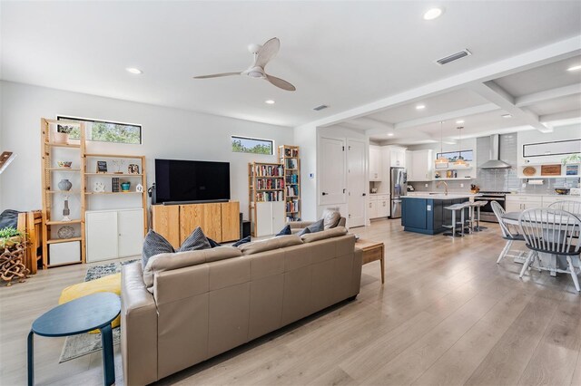 6904 S Macdill Ave Unit 1, Tampa, FL 33611 - living room featuring light wood-type flooring, recessed lighting, ceiling fan, and beam ceiling