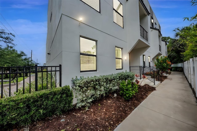 6904 S Macdill Ave Unit 1, Tampa, FL 33611 - view of property exterior with fence and stucco siding