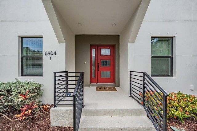 6904 S Macdill Ave Unit 1, Tampa, FL 33611 - view of exterior entry with stucco siding