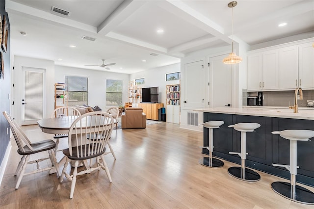 6904 S Macdill Ave Unit 1, Tampa, FL 33611 - dining space featuring beamed ceiling, light wood finished floors, ceiling fan, coffered ceiling, and recessed lighting