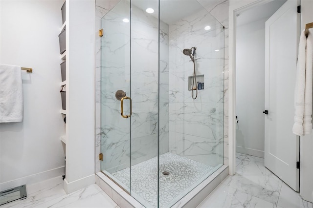 6904 S Macdill Ave Unit 1, Tampa, FL 33611 - bathroom featuring marble finish flooring, baseboards, a marble finish shower, and baseboard heating