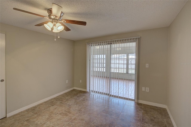 spare room with baseboards, a textured ceiling, and ceiling fan
