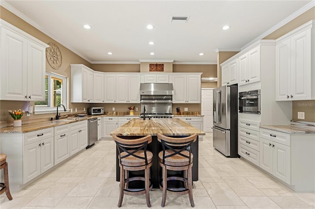 kitchen with visible vents, recessed lighting, white cabinets, and stainless steel appliances