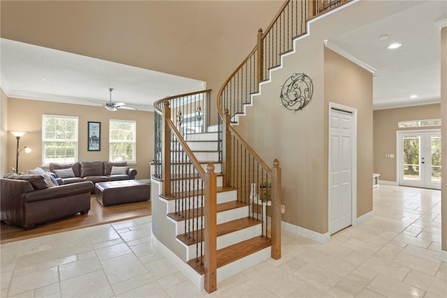 staircase featuring ceiling fan, french doors, baseboards, ornamental molding, and recessed lighting