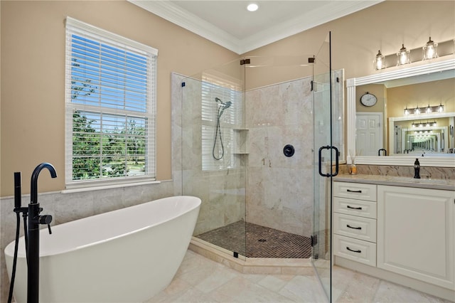 bathroom with vanity, ornamental molding, tile walls, a soaking tub, and a shower stall