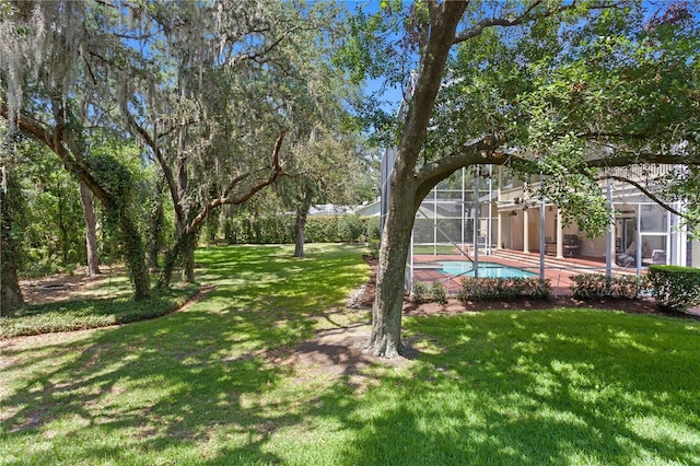 view of yard with an outdoor pool