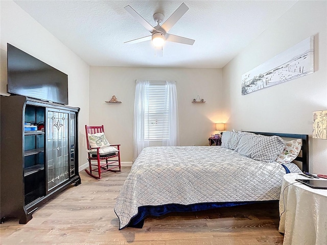 3205 Royal Tern Dr, Winter Haven, FL 33881 - bedroom with ceiling fan and light wood-type flooring