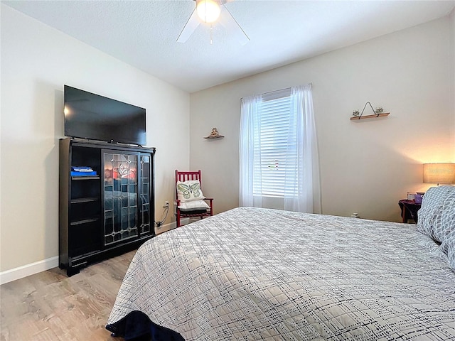 3205 Royal Tern Dr, Winter Haven, FL 33881 - bedroom featuring a ceiling fan, baseboards, and light wood-style floors