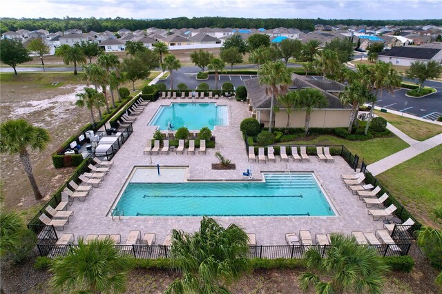 3205 Royal Tern Dr, Winter Haven, FL 33881 - view of swimming pool with fence and a residential view