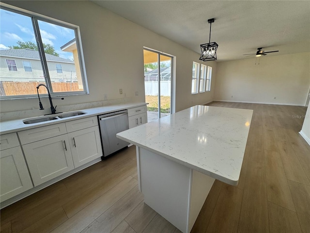 13506 Copper Belly Ct, Riverview, FL 33569 - kitchen featuring a sink, dishwasher, light wood-style floors, and a ceiling fan