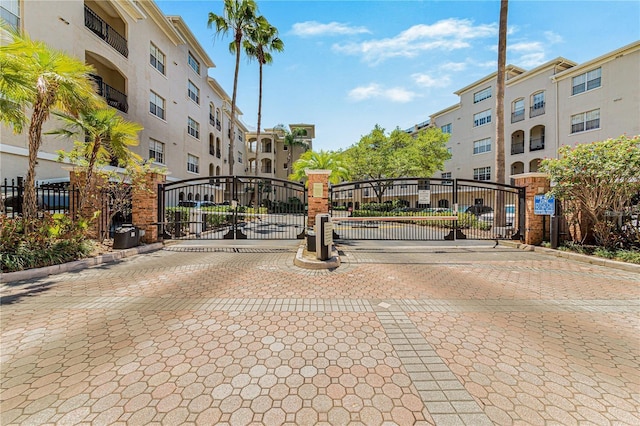 501 Knights Run Ave Unit 1335, Tampa, FL 33602 - view of road featuring a gate, a gated entry, and curbs