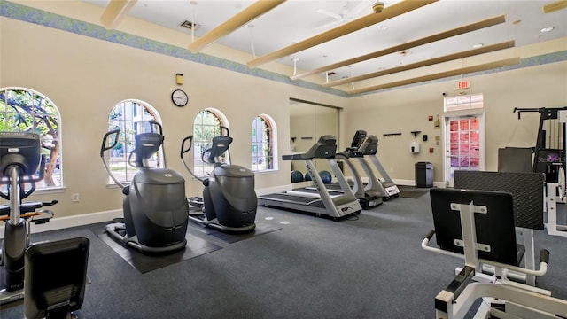 501 Knights Run Ave Unit 1335, Tampa, FL 33602 - gym with beam ceiling and baseboards