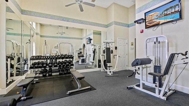 501 Knights Run Ave Unit 1335, Tampa, FL 33602 - gym featuring a ceiling fan, a high ceiling, and baseboards