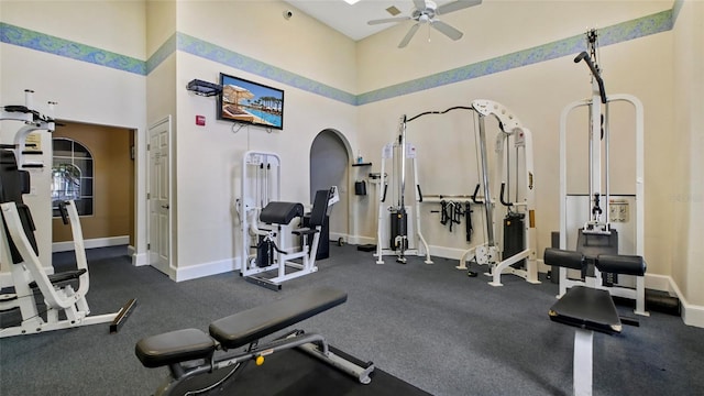 501 Knights Run Ave Unit 1335, Tampa, FL 33602 - workout area with a ceiling fan, a towering ceiling, and baseboards
