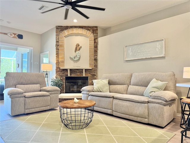 living room with visible vents, wood finished floors, a fireplace, recessed lighting, and a ceiling fan