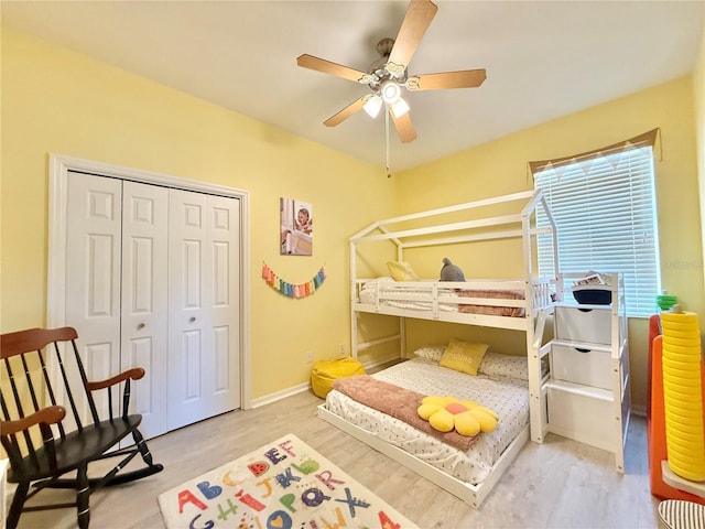 bedroom with ceiling fan and a closet