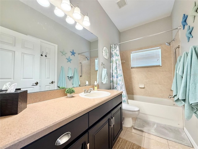 bathroom featuring visible vents, tile patterned flooring, shower / bath combo, vanity, and toilet