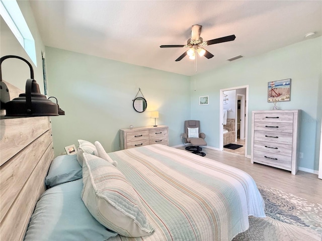 bedroom with ceiling fan, baseboards, visible vents, and wood finished floors
