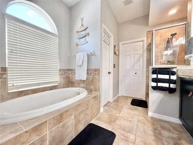 full bathroom with tiled shower, baseboards, a bath, and visible vents