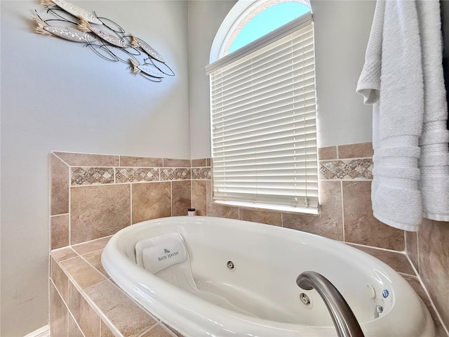 full bathroom with a whirlpool tub