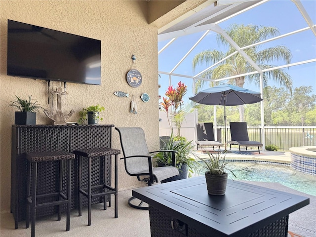 view of patio featuring a fenced in pool, a lanai, and fence