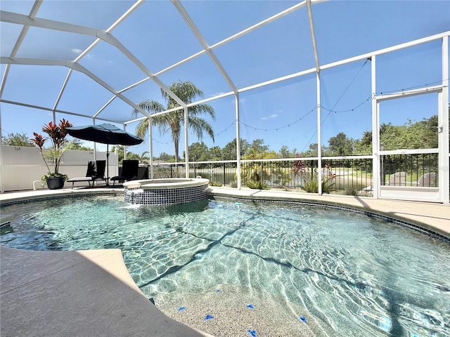 view of swimming pool featuring a patio, a pool with connected hot tub, and glass enclosure